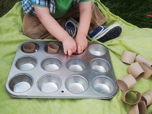Toddler Activity that teaches one to one correspondence. All you need is a muffin tin and a paper towel roll cut into small pieces!