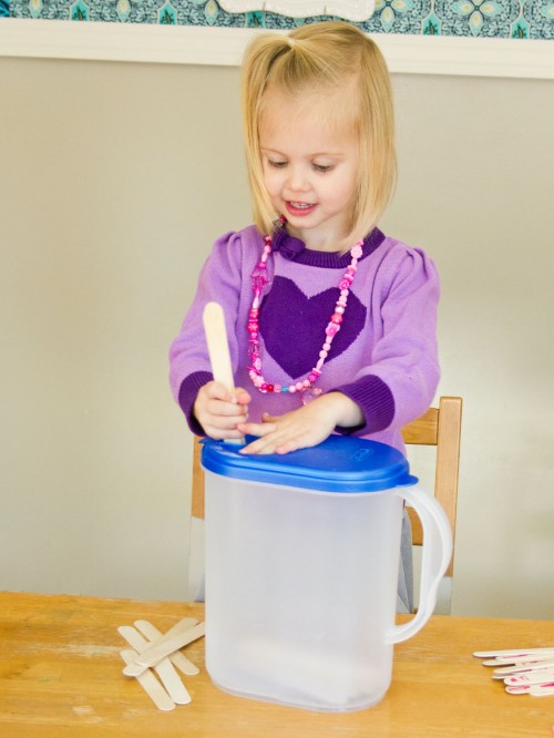 Easy Toddler Activity Idea: Popsicle Sticks in a Milk Jug