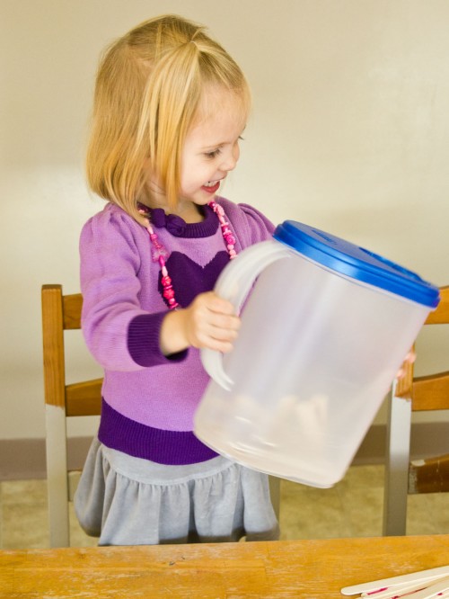 Easy Toddler Activity Idea: Popsicle Sticks in a Milk Jug