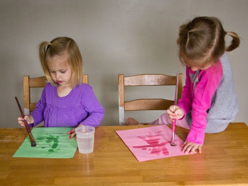 Water painting is a fun and super simple activity for toddlers. You just need construction paper, paintbrushes, and a cup of water.