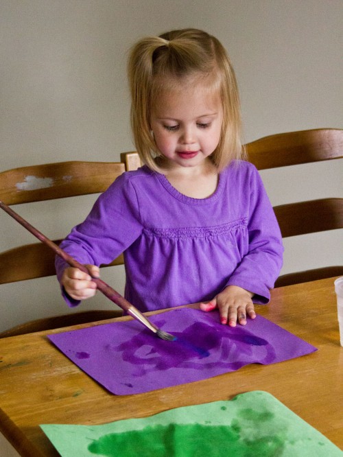Water painting is a fun and super simple activity for toddlers. You just need construction paper, paintbrushes, and a cup of water.