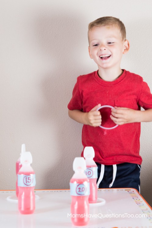 Ring Toss with Juice Bottles - 4th of July Games - www.momshavequestionstoo.com