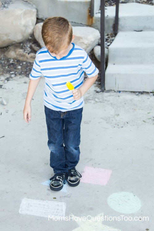 Help improve gross motor skills with a fun game of jumping on chalk shapes and colors - Moms Have Questions Too
