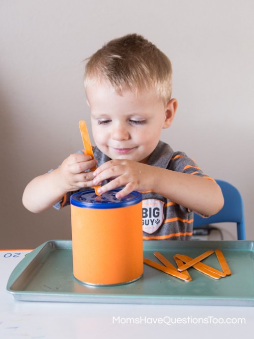 Putting Popsicle Sticks in a Can for Orange Tot School Trays - Moms Have Questions Too