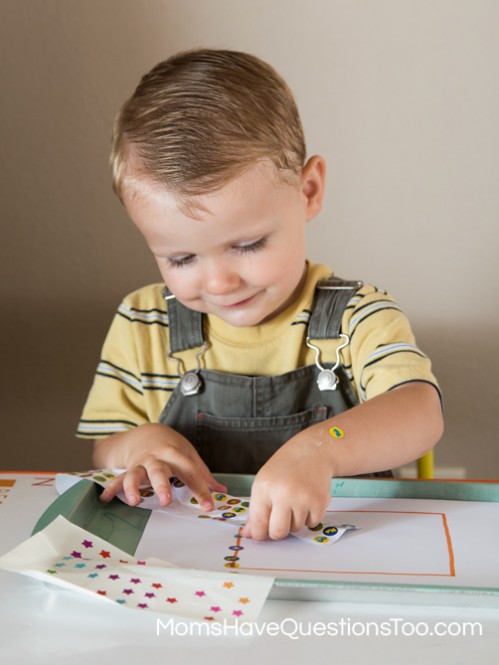Put Stickers on a square shape for fine motor skills development - Moms Have Questions Too