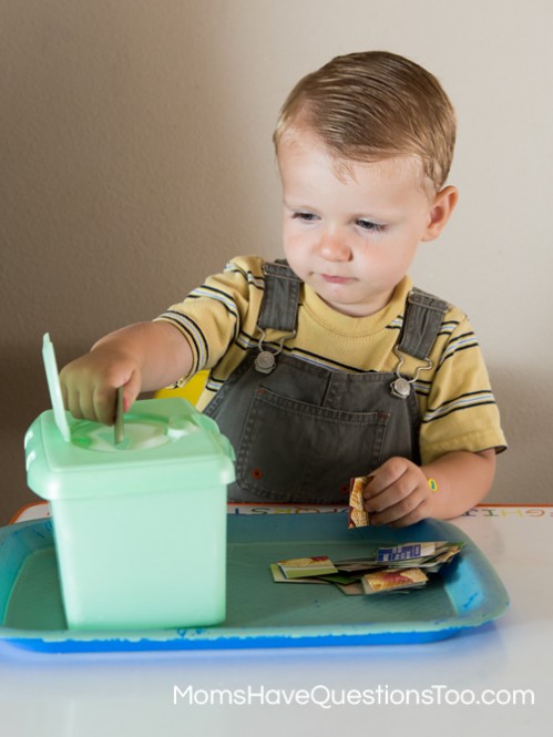 Put cardboard squares in a wipes container for fine motor skills development - Moms Have Questions Too