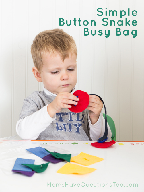 Pushing the shapes on the Button Snake Busy Bag - Moms Have Questions Too