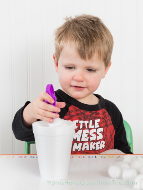 Transfer cotton balls to cup using kid tweezers - Moms Have Questions Too