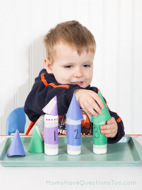 Teach numbers and counting with tot trays. Ideas for number cards, numbered cups and objects, printables, and dice activities.