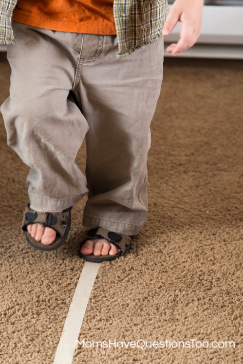 Practice walking on a straight line to develop gross motor skills - Moms Have Questions Too