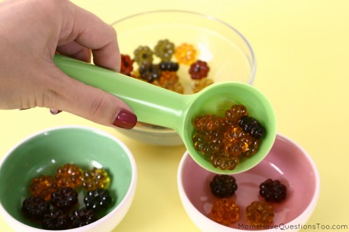 15 toddler activities that use table scatter (also called math manipulatives). These teach counting, creativity, fine motor, and more!