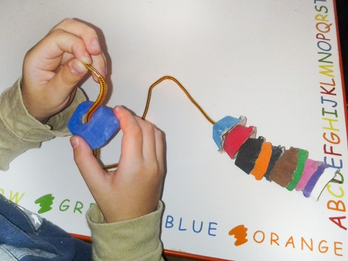 Toddler Activity Idea: Bead painted egg carton pieces onto a shoelace