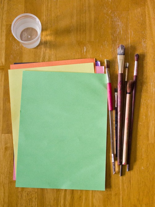Water painting is a fun and super simple activity for toddlers. You just need construction paper, paintbrushes, and a cup of water.