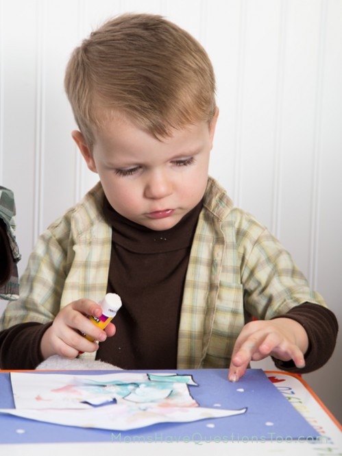 Gluing dots on paper for snowflakes - Moms Have Questions Too